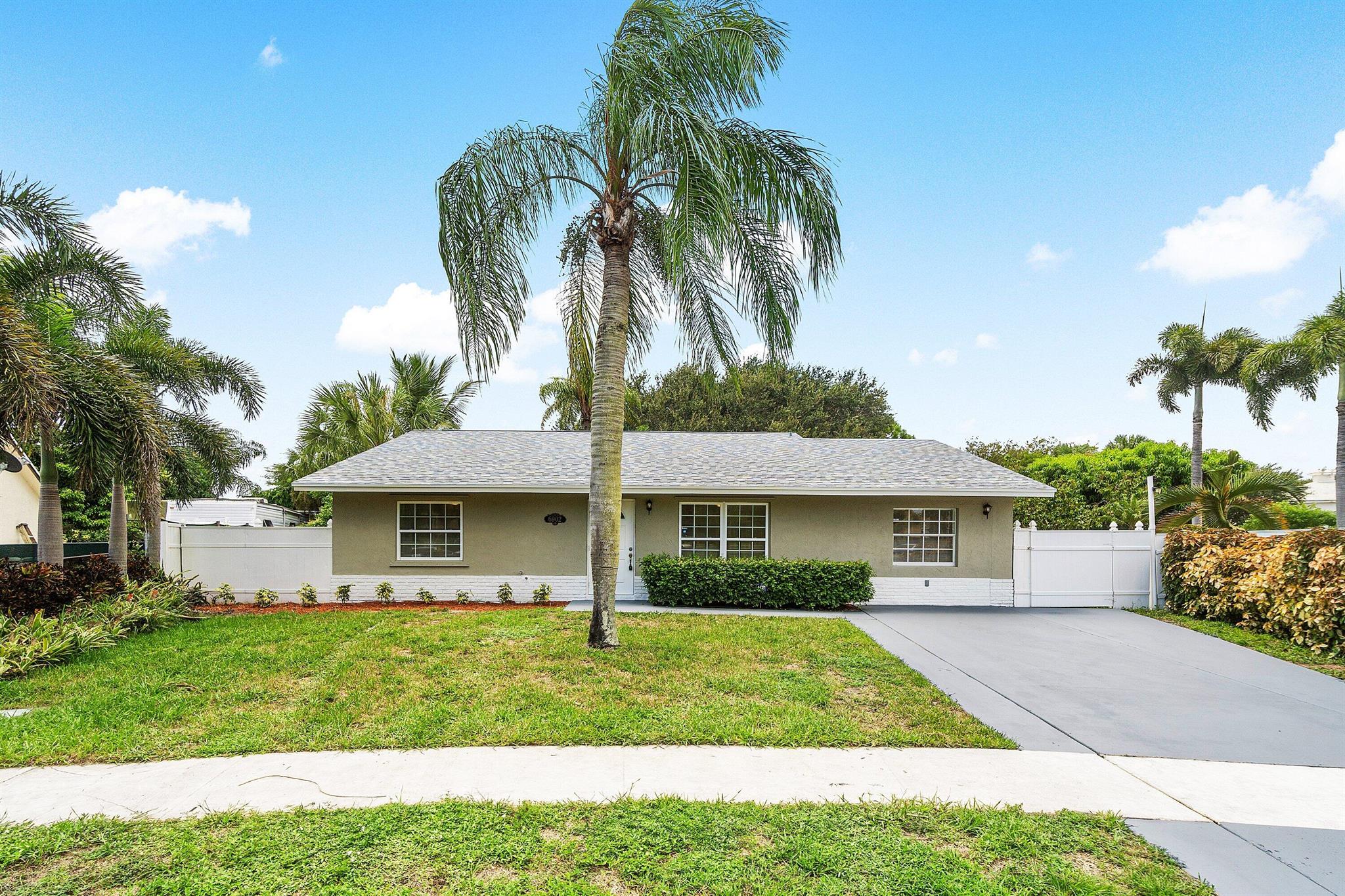 Beautifully renovated 3 bedroom, 2 bathroom home featuring an updated kitchen with white cabinets, granite countertops and stainless steel appliances. Bathrooms are refreshed with new vanities, tile and fixtures, while new luxury flooring flows throughout. Enjoy peace of mind with a new roof, new AC and new water heater. Relax or entertain in the screened patio overlooking the enormous private backyard, perfect for outdoor living. This move-in ready home combines modern updates with a spacious layout inside and out.