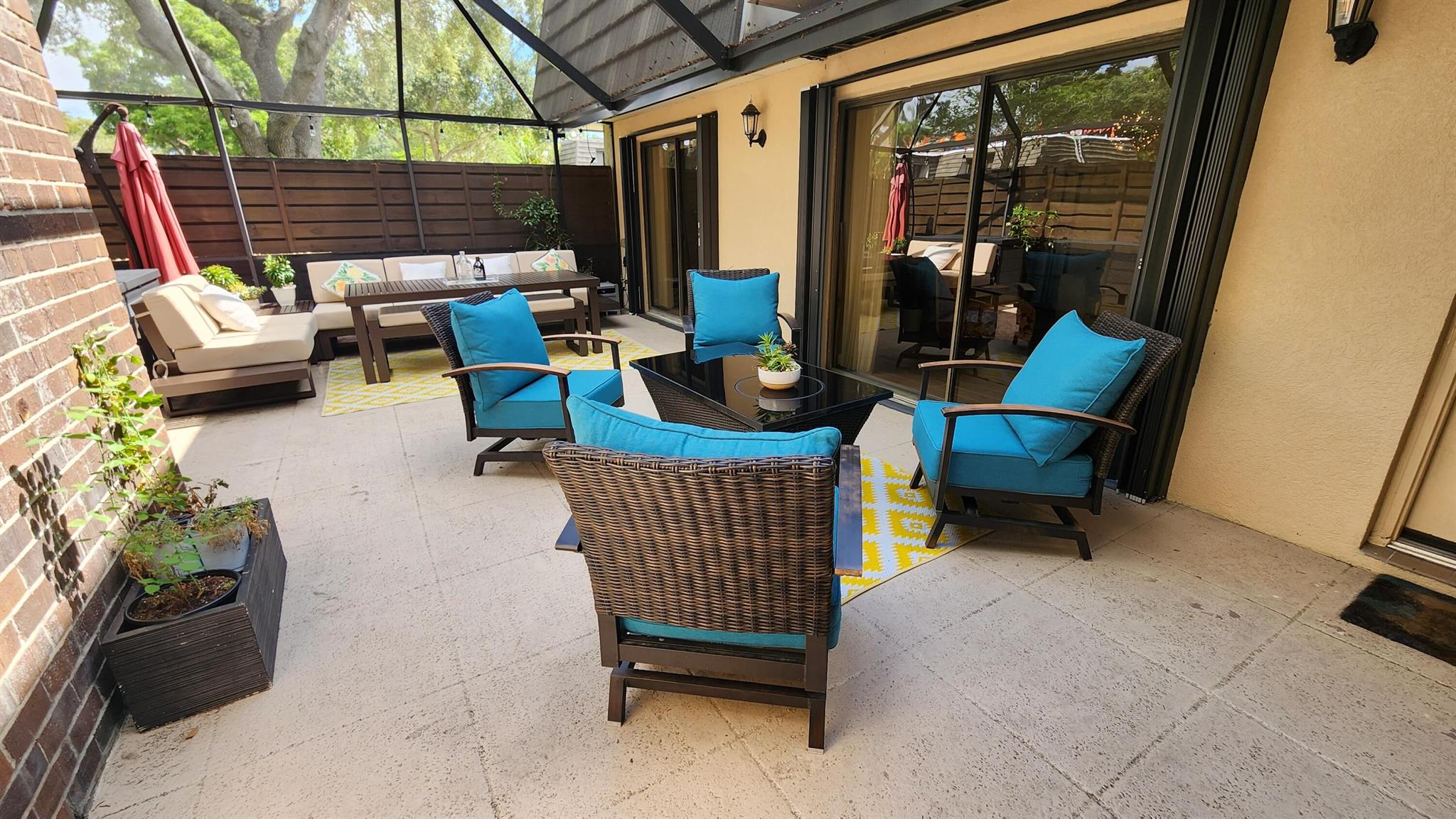 Beautifully updated 3 bedrm, 2.5 bath townhome located in the prestigious PGA National's Glenwood community. Available furnished or unfurnished for no less than 12-months. 2 assigned parking spaces located in front of home. 1 well behaved dog of any size will be welcome w/ owner approval. Floor to ceiling windows in every room & the view from the home is all trees. Fully screened private patio courtyard, (18 x 28 sqft) is quiet & peaceful. Newer A/C & easy Accordion hurricane shutters. Kitchen newly updated, has lots of storage & a breakfast bar. 1st floor has wood-look plank tile floors. 1 bedrm on 1st floor, master & 2nd bedrm on 2nd floor. Conveniently located close to community pool, tennis / pickleball courts, racquetball courts, & 1.5 mile tree lined fitness trail