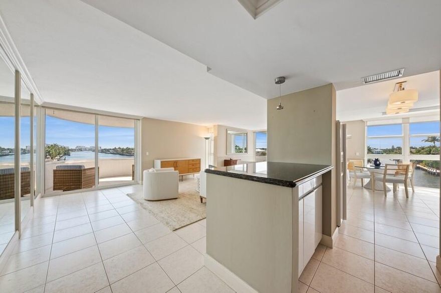Coastal House, 401 is a beautifully updated & rarely available Intracoastal corner residence w/ breathtaking waterfront views from each room & 2 balconies. Light & neutral, this open & airy corner unit features an updated kitchen w/ sleek white cabinetry, granite counters & glass subway tile backsplash. The dining area is situated directly over the sparkling Intracoastal w/ spectacular sunset views. The primary suite has gorgeous water views & includes beadboard detailing & a fabulously renovated bathroom w/ upgraded cabinetry & a glass walk-in shower. The second suite features incredible built-ins w/ extra storage, perfect for an office or guest quarters. The expansive water vistas are magnificent from this highly sought after, 01-stack unit, an Intracoastal paradise not to be missed!