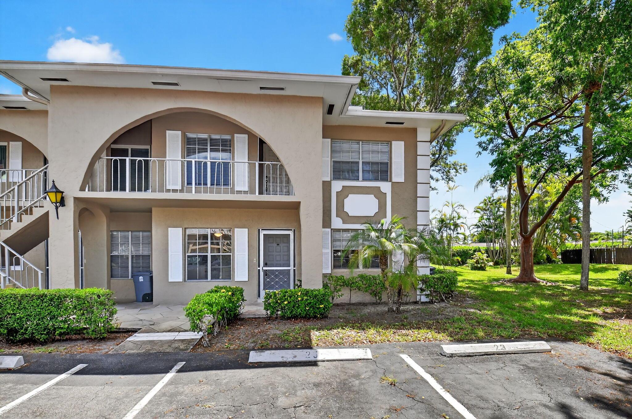 Ready for your personal touch! Spacious 2BR/2BA first-floor end unit in the ever popular 55+ community of Palm Greens! Features are an eat-in kitchen, separate living/dining area, enclosed Florida room, washer/dryer, and flexible 2nd bedroom/den. Updates include new A/C (2024), new electrical panel (2025), and newer guest toilet. Bright and airy with extra windows! Enjoy low monthly fees including cable, internet, water, roof & exterior maintenance and all common area maintenance, building insurance. Exciting new 30,000 sq. ft. clubhouse with resort-style pool, pickleball, tennis, fitness center & more is coming soon. Rentals permitted after 2 years.