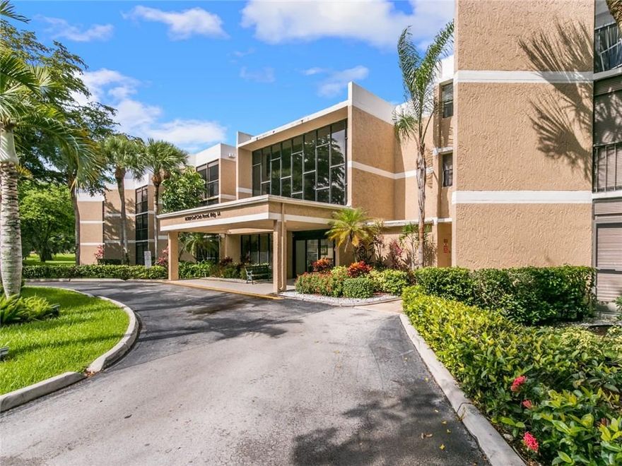 Country Club Village - Spacious 2 BR 2.5 Bath, 2nd Floor Corner Condo with Lobby Entrance. Additional room on Balcony with glassed sliding doors offers a total of 1500 sf. Split Bedroom Plan for both convenience & privacy. The Corner location adds a window in the kitchen with golf course views. (Only 6 units in bldg. have a kitchen window). Eat-in kitchen with full size Washer/Dryer. Brand New Carpet throughout, tiled Kitchen/Balcony andnewer A/C. Town Center Clubhouse has Gym-Tennis-Bowling & much more