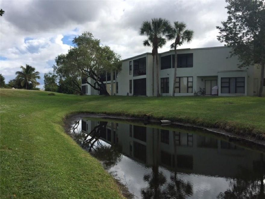 Best kept secret in Boca. Beautifully updated. Great views! Master suite with walk in closet. Updated kitchen with granite counters, s/s appliances and inline water filter.  New full size HE washer and dryer. Tile and hardwood floors. Lots of closet space. Pet welcome with restrictions. Large private patio overlooking serene park-like setting with water views. Mature trees. Maintenance includes cable, water, 2 pools with hot-tubs and saunas. Boca dream awaits in this condo paradise!