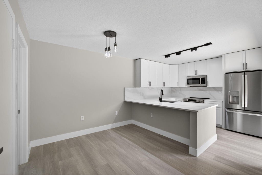 Photo of 246 Charter Way, West Palm Beach, FL 33407 (MLS # B26036536)