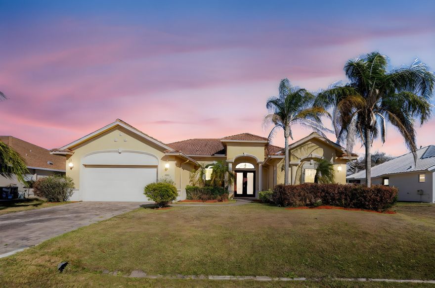 Welcome to this beautifully upgraded home located in the heart of Port St. Lucie! This move-in-ready property offers the perfect blend of modern upgrades, functional living space, and Florida lifestyle. Upgraded Chef inspired kitchen ideal for entertaining featuring quartz countertops, stainless steel appliances, sleek white cabinetry, a statement stainless steel range hood overtop a center island with built-in cooktop. Perfect for entertaining or everyday living. The open-concept layout flows seamlessly into the main living and dining areas, creating a bright and inviting atmosphere. Bathrooms have been tastefully upgraded. The spacious backyard offers plenty of room for a pool, Close to I95 and the beach.