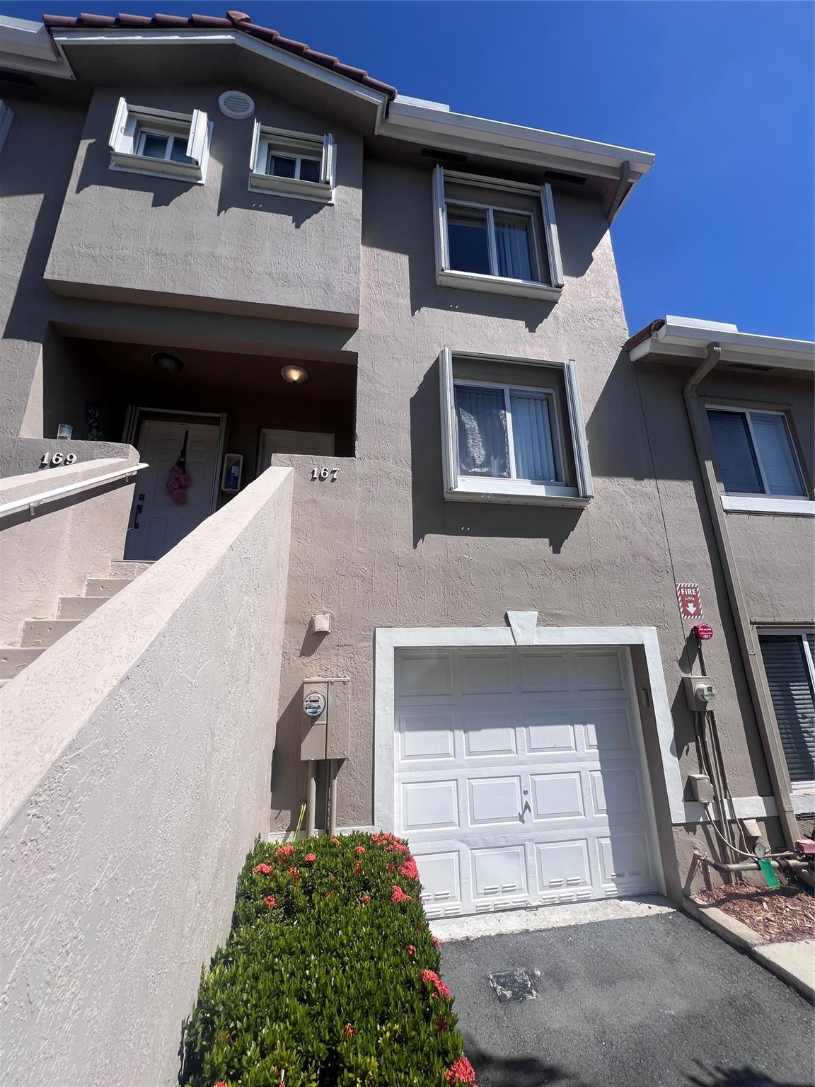 Discover this 3-bed, 3-bath tri-level townhome in the heart of Weston, FL! Enjoy the convenience of an attached garage, ample living space across three levels, & a prime location close to major roadways, shopping, dining, & top-rated schools. This spacious townhome with a garage offers the perfect blend of comfort & convenience. Step inside to discover a thoughtfully designed layout featuring a full bedroom & bathroom on the first floor—ideal for guests, in-laws, or a private home office. The second floor boasts an inviting open-concept living & dining area complemented by a modern kitchen with elegant wood cabinetry & sleek granite countertops. The third floor offers two bedrooms with access to newly renovated bathrooms. There is no association approval required - quick move-in allowed.