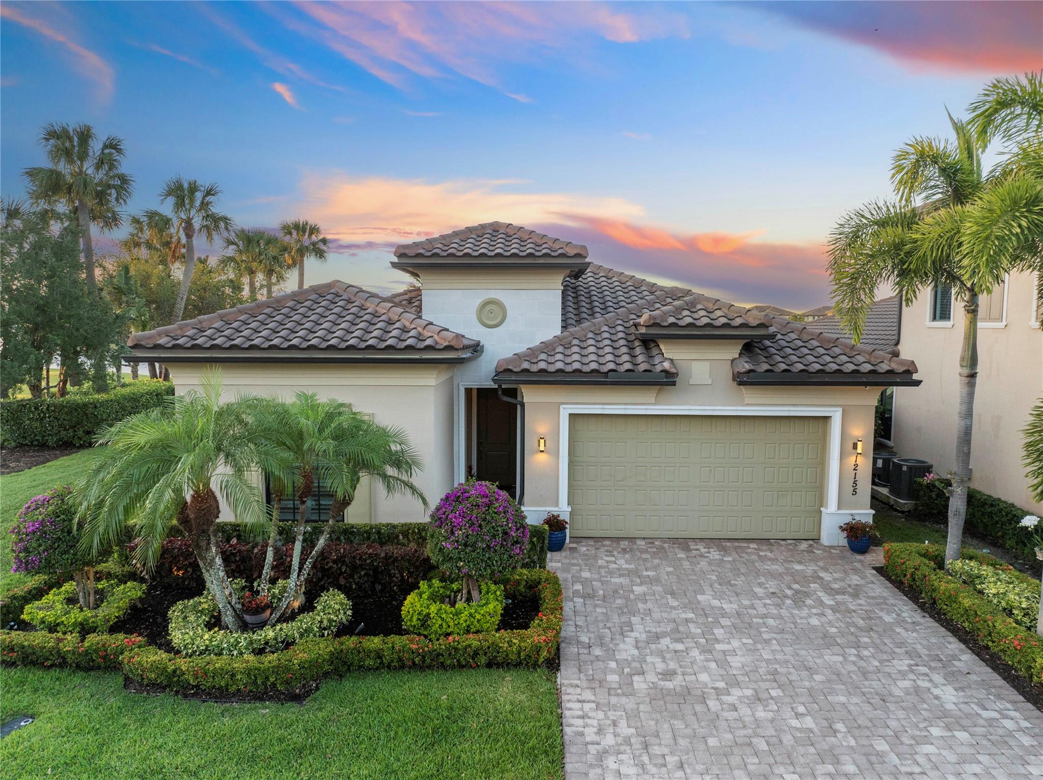 LOWEST PRICE ON LAKE IN PARKLAND BAY. Welcome to this stunning 4 bedroom, 2 and a half bath home offering elegant wood like tile floors throughout and crown molding in every room. Impact windows and doors. The gourmet kitchen is a chef’s dream, featuring a large center island with quartz countertops, wood cabinetry, double ovens, and a spacious walk-in pantry. Primary bedroom has 2 custom built closets. Primary bath has 2 sinks, roman tub, private toilet and large shower equipped with frameless glass doors. Plantation shutters add a touch of charm and privacy throughout the home. Enjoy serene lake views from the comfort of your screened patio.