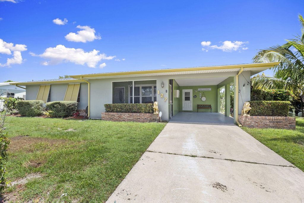 Photo of 127 NE Penlynn Avenue, Port Saint Lucie, FL 34983 (MLS # R11110938)