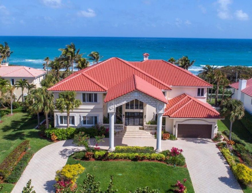 Inspiring a sense of Old Florida serenity, this Modern Mediterranean oceanfront estate sits high above the dunes, where glistening blue waters backdrop the lush outdoor oasis by the alluring lagoon-style pool. Stepping in from the grand porte cochere, the ocean view fills the impressive great room featuring a fireplace and wet bar. The enormous master wing creates its own haven of comfortable luxury. A private boardwalk leads to the beach. Dining room and foyer chandelier are excluded from the sale.The information herein is deemed reliable and subject to errors, omissions or changes without notice.  The information has been derived from architectural plans or county records. Buyer should verify all measurements.  See supplement