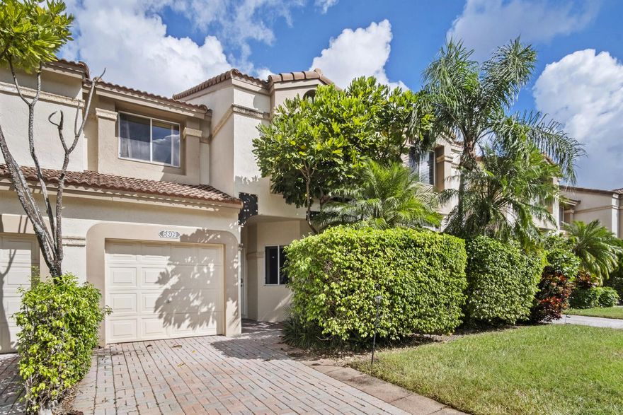 Boca's best in Boca Pointe!  Spacious town home with garage in ideal location in community, near community pool but away from busy streets and noise. Gorgeous updated kitchen with eat in area, bar/island, light bright and tons of storage. Large open living space with double sliders to your private very large screened in patio with tropical foliage. First floor has a half bath and large under stair storage. Entire first floor with beautiful  light laminate flooring.   Upstairs has all tile floors with very large primary suite. Huge closet! Separate laundry room with new washer and dryer.  May rent immediately(4 times per year) and membership to club not mandatory but available. 24 hour Manned gate. Great schools! All measurements are approximate.