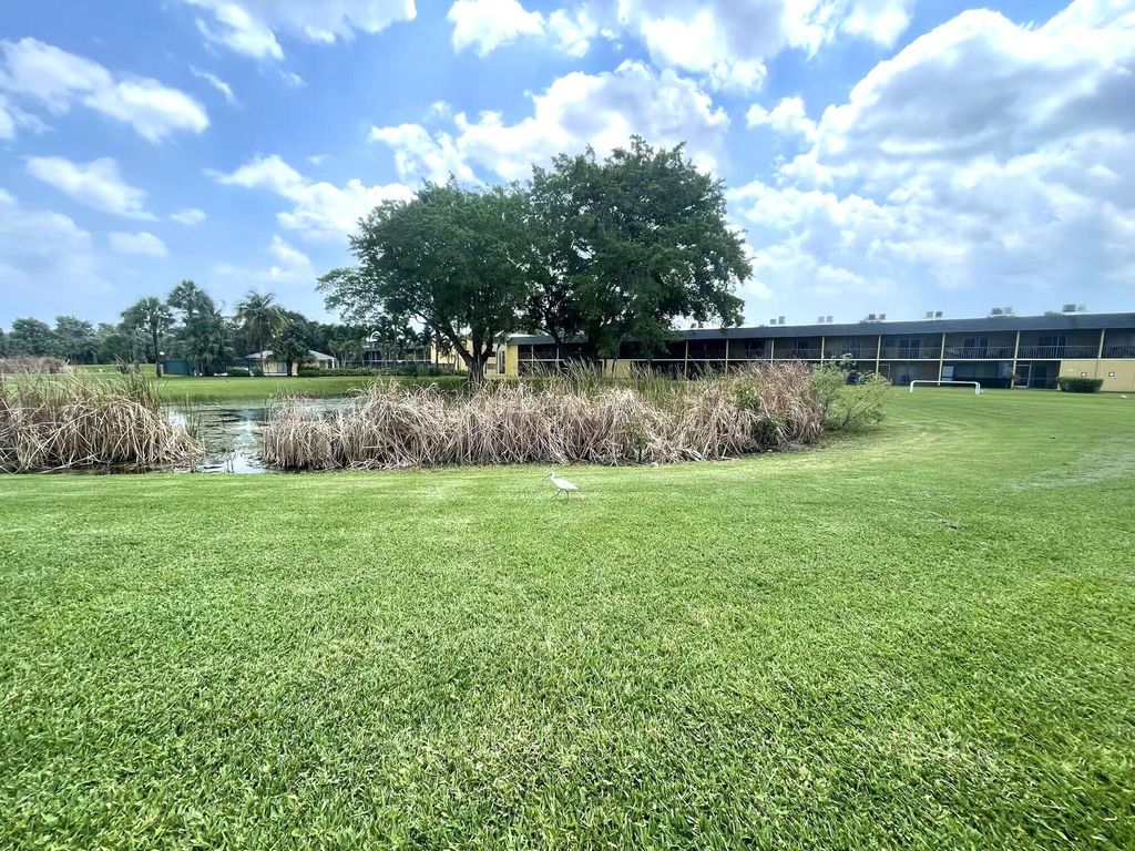 Photo of 1811 Meadows Circle W, Boynton Beach, FL 33436 (MLS # B26034174)