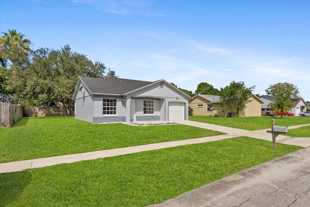 Photo of 1355 Denlow Lane, Royal Palm Beach, FL 33411 (MLS # R11127086)