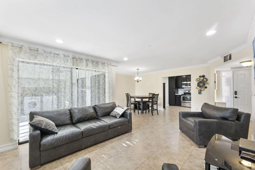 **SELLER IS MOTIVATED** ** OPEN TO ALL OFFERS**
Welcome to this ready-to-move-in home with a spacious open layout and neutral tile flooring. The main living areas have recessed lighting. The kitchen stands out with rich espresso cabinets, stainless steel appliances, and a stylish mosaic tile backsplash. You can enjoy meals in the dining area under a classic chandelier or relax in the living room with elegant plantation shutters.

The bedroom is a cozy retreat with dark wood-look flooring, crown molding, and a ceiling fan. The renovated bathroom features a modern vanity, contemporary lighting, and a tiled shower with sliding glass doors. A special fe