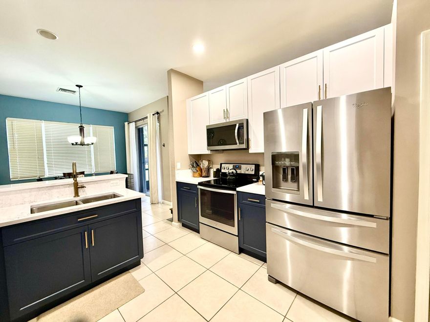 Beautifully UPGRADED and very spacious 3-bedroom, 2.5-bath townhome with over 2,100 sqft & peaceful LAKE VIEW. This home features hurricane accordion shutters, an impact-rated front door, newer A/C and water heater, and upgraded recessed lighting throughout the townhome.The remodeled kitchen offers 42'' cabinets and quartz countertops, while the downstairs bathroom has been tastefully updated. Enjoy the open feel with an 8-foot doors and relax on the screened patio overlooking the lake.
Located in the desirable gated Newport Isles community, enjoy 24-hour security, a clubhouse with fitness center, resort-style pools, tennis & basketball courts, playgrounds, & scenic walking paths. Conveniently located near shopping, dining, and major highways I-95. Well maintained, perfect for FL living. This home also features soft-close cabinets, adding a modern and high-end touch to the remodeled kitchen and bathrooms.