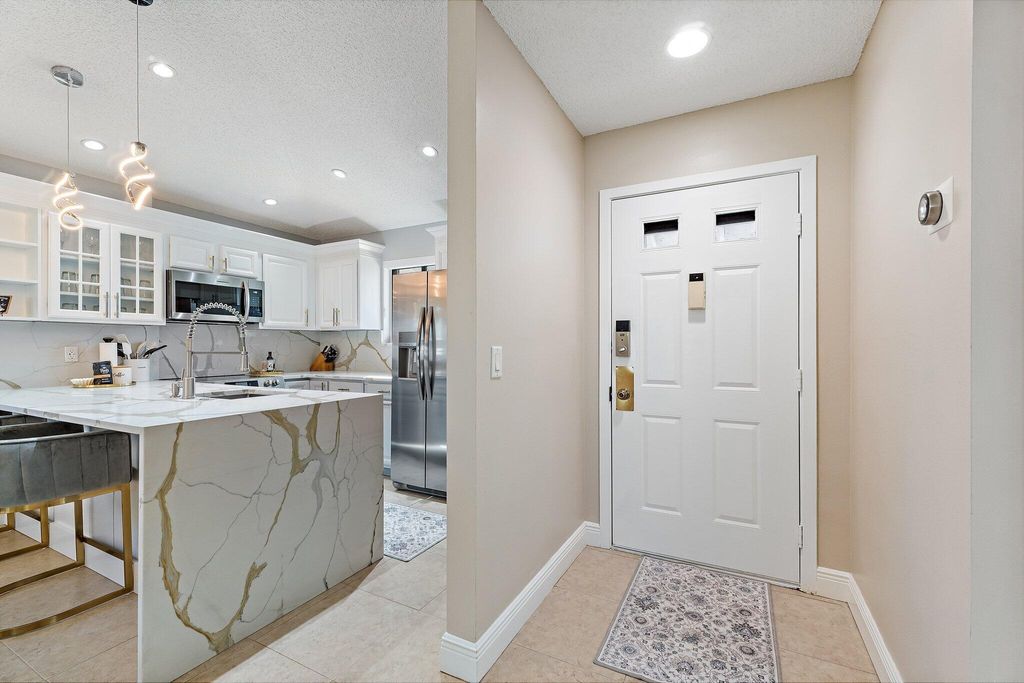 Photo of 212 Club Drive, Palm Beach Gardens, FL 33418 (MLS # R11146901)