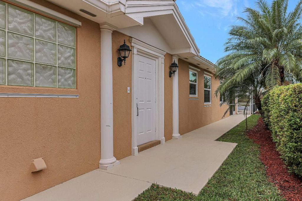 Photo of 12050 SW Elsinore Drive, Port Saint Lucie, FL 34987 (MLS # R10928464)