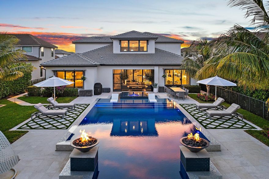 Welcome to your new move-in ready designer home in the heart of Jupiter's premier gated and family-friendly community of Sonoma Isles. This residence sits on a beautiful, oversized Cul de Sac lot with exquisite tropical landscaping and an award-winning designed saltwater pool/spa, the largest in the community. As you step inside the soaring 2-story foyer, you will be greeted by tons of natural light in this open-concept living space filled with designer/luxury upgrades, features (custom built-in wall unit, molding, trim, wallpaper, beams etc.), and furnishings. This home could come completely furnished. This part-time/lightly lived in home is the much sought-after Garden Vista model boasting four bedrooms (primary on the first floor) five and a half baths, including a full cabana bath, an