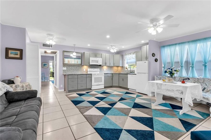 Beautiful fully remodeled 1 bed, 1.5 bath corner with water view and central air. NEW FULLY OPEN KITCHEN, NEW appliances, counters, backsplash, LED lighting, all tile floors, NEW BATHS, NEW EVERYTHING. CORNER, Beautiful water and garden views. Enjoy sunrise over the water and lush landscaping. Central AC (2007 compressor, 2009 air handler blows cold). Screened porch, flat ceilings, fresh paint, super clean home.Gated, 24 hour security, Adult condominium community, extensive facilities, 16 pools, theatres, fitness, activities. Life the active Florida lifestyle in a wonderful, safe gated community 3.3 miles close to beach. Courtesy bus. 2nd Floor unit.