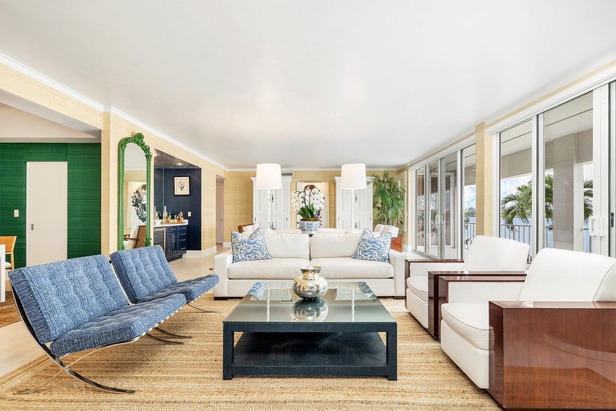 This beautifully renovated 2,745 +/-total square foot waterfront apartment, located in Chateau Cheverny on Ibis Isle, features four bedrooms, three and a half baths, and 70 feet of direct Intracoastal views. Enjoy spectacular sunsets from all major rooms. The residence features 9 foot ceilings, a large living room, a covered terrace, a dining room, an all-new eat-in kitchen with views of the water through the new wet bar, graciously sized bedrooms, newly renovated bathrooms, custom lighting, parquet wood floors, impact windows, and newly installed impact doors. Ibis Isle has a community pool, and a security guard (stationed as you enter the island) every day from 6pm to 6am. The building also offers an elevator, storage, and disposal room. The Chateau Cheverny building underwent an entire foundation re-build in 2019 with Helical pilings all the way to the bedrock. The seawall was maintained and fortified in August of 2021. The homeowner's association fully replaced and paved the seawall walkway, the parking lot (south of the building), and the horseshoe driveway.