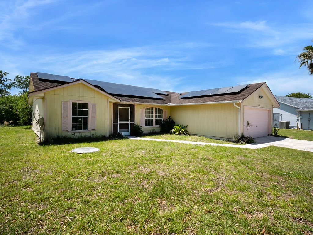 Photo of 1094 SW Cairo Avenue, Port Saint Lucie, FL 34953 (MLS # B26020958)