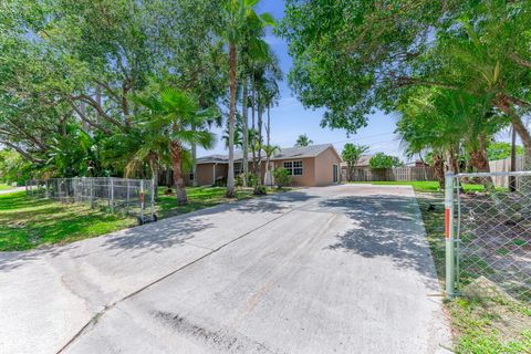 Photo of 9159 Honeywell Road, Lake Worth, FL 33467 (MLS # B26025964)