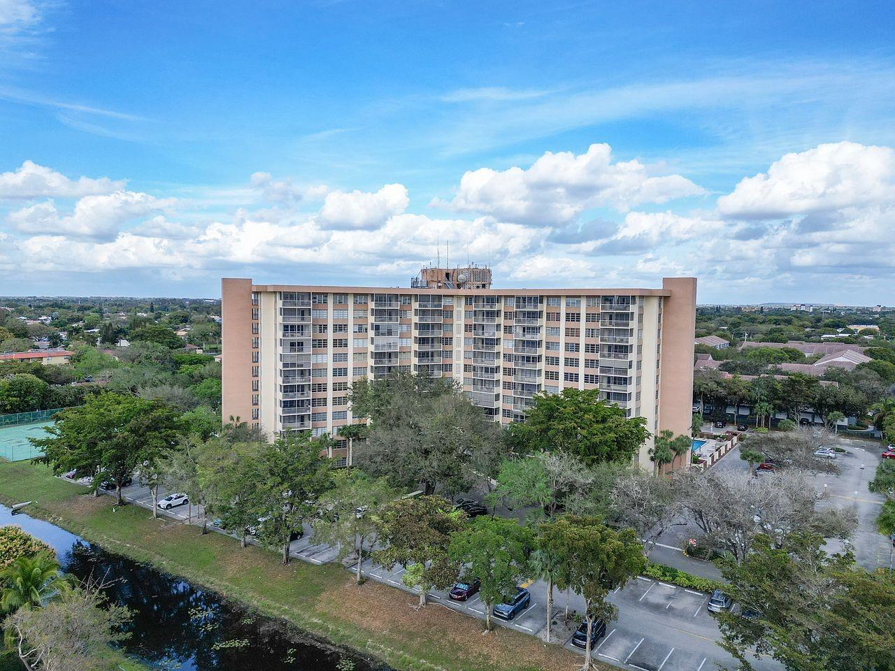 *** WOW, HUGE PRICE REDUCTION by $15K, SELLER says SELL!!! *** LUXURIOUS LIVING in this 2-BED, 2-BATH CONDO. with STUNNING CITY VIEWS in Coral Springs CC * OPEN LIVING AREA w/ CUSTOM BUILT-IN WALL UNIT and SPLIT-BEDROOMS * REMODELED KITCHEN W/ GRANITE COUNTERS and BEAUTFUL TRAVERTINE BACKSPLASH * MAIN SUITE boasts a WALK-IN CLOSET, while the BATH is UPDATED w/ GRANITE COUNTER and LUXURIOUS MARBLE TUB & SHOWER COMBO. * 2nd BATH is also UPDATED w/ GRANITE COUNTER and GLASS SHOWER DOOR * A SERENE SCREENED BALCONY, AMPLE STORAGE, CONVENIENT & CLEAN LAUNDRY FACILITIES * SECURE BUILDING with 24/7 front desk SECURITY * HEATED COMMUNITY POOL, FITNESS ROOM, and MORE! CENTRAL LOCATION across from the COUNTRY CLUB and near the NEW DOWNTOWN CORAL SPRINGS. HOPA, AGE 55+ BLDG.