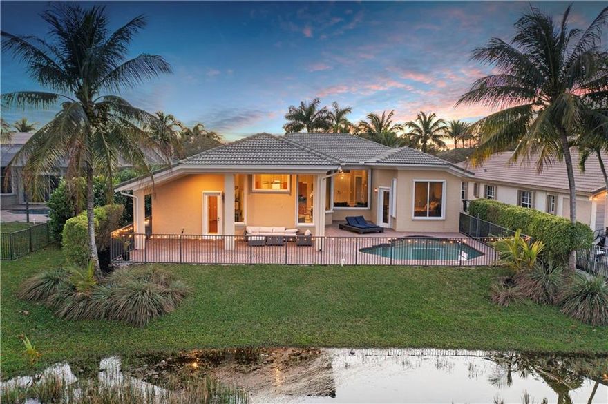 True 5 Beds, 3 Baths Waterfront Pool Home w/3-Car Garage In Prestigious Heron Bay The Highlands Community! Popular Carmel Tri-Split Floor Plan Ideal For A Large Family.  Spacious Kitchen w/Stainless Steel Appliances, Double Oven, Granite Counters & Large Island & Breakfast Area Overlooking Back Patio, Large Family Room Perfect For Entire Family, Real Wood Floors In All Beds, Private Primary Bed w/Sitting Area, Walk-In Closets w/Built-In's, Primary Bath w/Separate Jacuzzi Tub & Shower, Accordion Shutters, Dual Sinks, Separate Kids' Beds w/Jack & Jill Bath, 5th Bath Perfect For Game Room Or In-Law Suite w/Cabana Bath Enjoy Sunrises & Cool Breezes On Covered Patio Area, Resort Style Amenities Including 2 Clubhouses, 24-Hour Guard Gated, Low HOA Dues, A-Rated Schools! Won't Last Long!