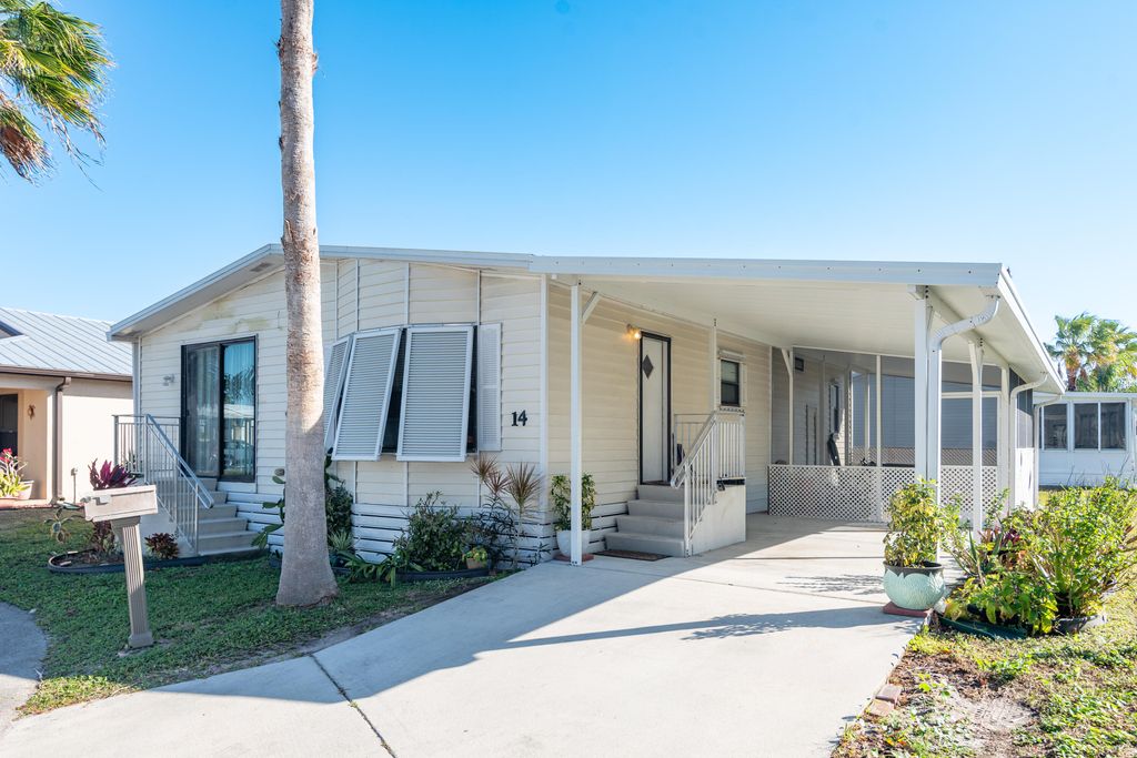 Photo of 14 Jacaranda Lane, Port Saint Lucie, FL 34952 (MLS # R11163926)