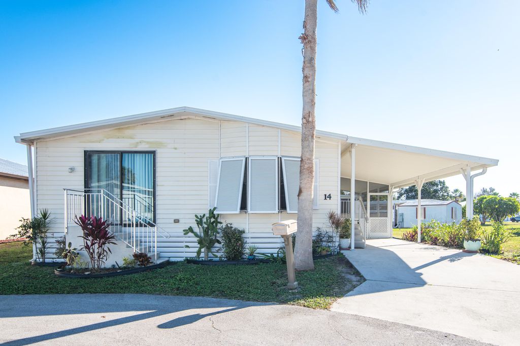 Photo of 14 Jacaranda Lane, Port Saint Lucie, FL 34952 (MLS # R11163926)