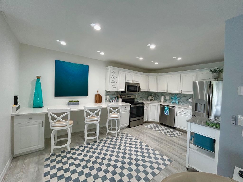 Photo of 327 Knotty Pine Circle #B-2, Greenacres, FL 33463 (MLS # R11110509)