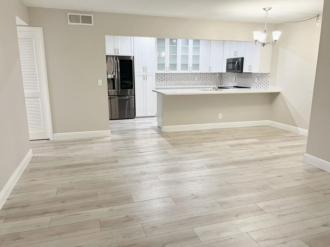 Enjoy the security of a gated community. Home features fully renovated kitchen, newer appliances and flooring. Washer and dryer in the unit. Screened in patio perfect for relaxing and community pool for weekend fun.