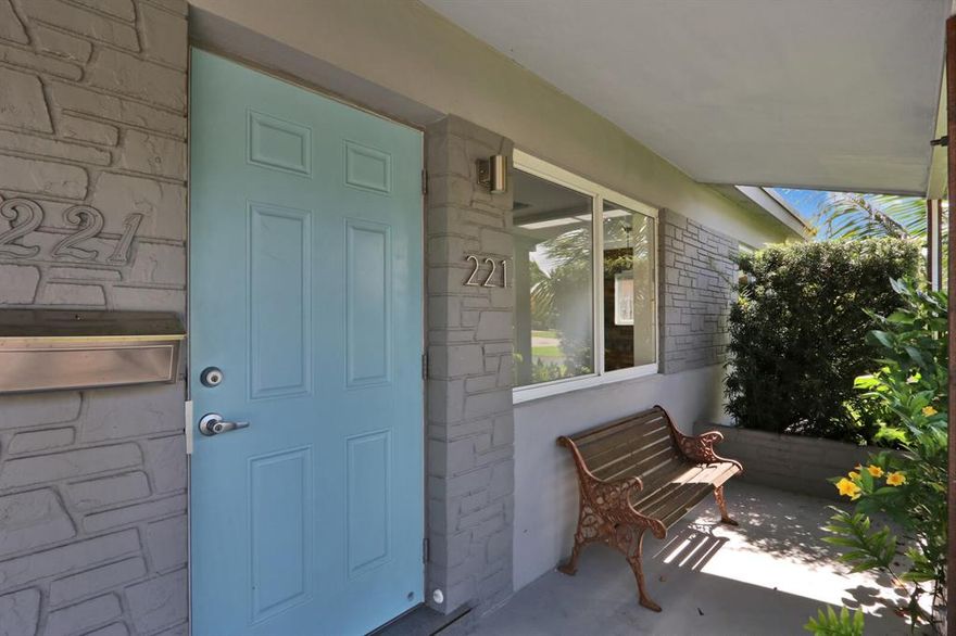 $10,000 PRICE REDUCTION! This 2 bedroom, 2 bathroom tropical oasis is HOT AND READY! Completely updated, so you can move right in! No detail was overlooked here — updated kitchen, bathrooms, porcelain tile floors, and more! Impact windows, stainless steel appliances, smart thermostat, washer, dryer. The fully-fenced backyard has also been beautifully updated and maintained,  and features a sprinkler system. This backyard also has a peaceful outdoor lounge, complete with swings and lighting. All of this within 10 minutes of the beach!