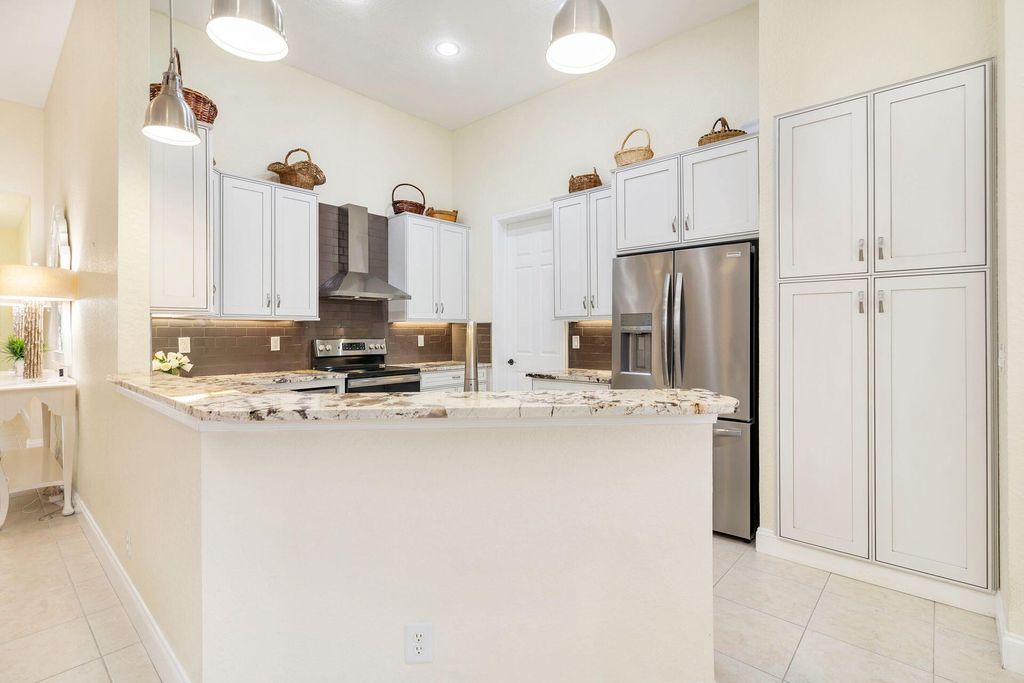 Photo of 140 Via Rosina, Jupiter, FL 33458 (MLS # R10963109)