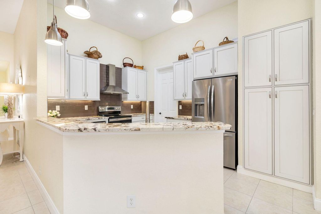 Photo of 140 Via Rosina, Jupiter, FL 33458 (MLS # R10963109)