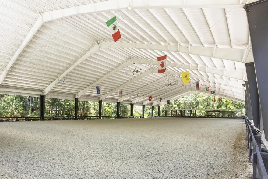 Discover an equestrian haven beyond the iron gates where serene natural beauty meets exceptional functionality. This property features lush grounds that frame a picturesque Swan Lakea''an idyllic centerpiece surrounded by stunning landscaping and vibrancy. A new Covered Arena with premium GGT awaits with State of the Art Ebb and Flow system. The property boasts 12 stalls, and lush, maintained paddocks. Barn is exclusive and has commanding, dedicated iron gate entrance separate from other side! Mins to WEF and Global, Perfect facility for jumpers or dressage. Owner adding second ring at South corner entrance. You will love your training here overlooking beautiful trees, paddocks, and lovely pond with beautiful swans. The pagoda gazebo is a wonderful area to relax and unwind after riding.