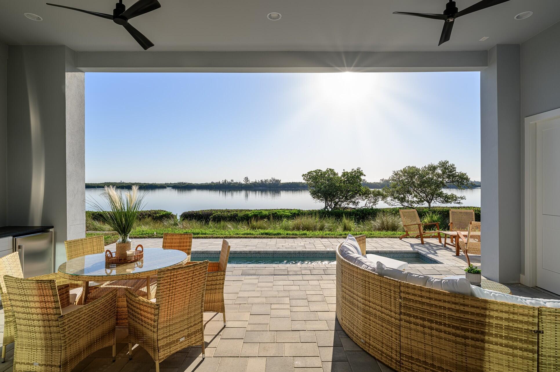 Brand New luxury construction at gated Grand Harbor! Enjoy true waterfront living with GOLF, boat slips, TENNIS, pickle ball, LUXURY clubhouse & OCEANFRONT clubhouse, all at your fingertips. Sip your coffee & watch the sunrise from your riverfront pool. The al fresco riverfront kitchen allows casual dining with friends and family overlooking the pool and river. Concrete block & soaring ceilings with this 4 bedroom, 3 car garage, spacious open concept new build with water views & attention to detail with a luxury home builder. This home has the highest quality finishes, all impact windows & doors, and concrete block construction.