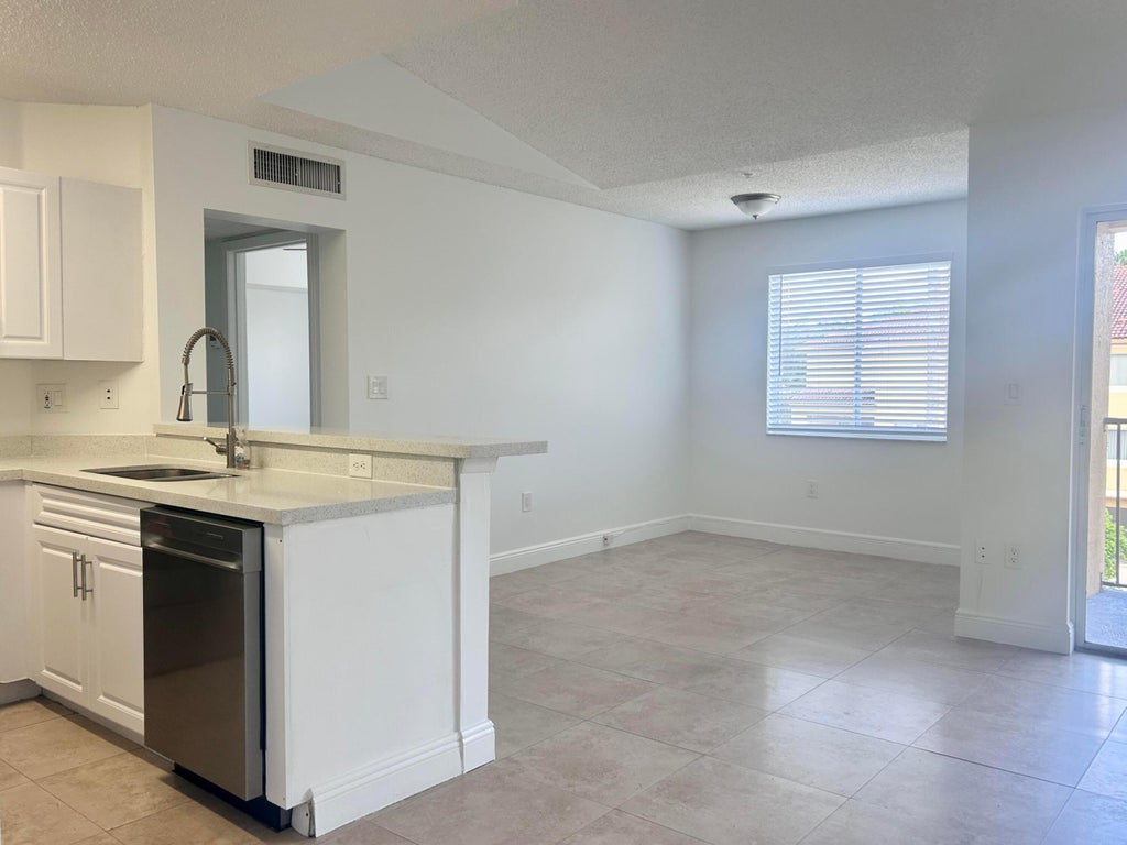 Photo of 771 N PINE ISLAND Road #308, Plantation, FL 33324 (MLS # B26085107)