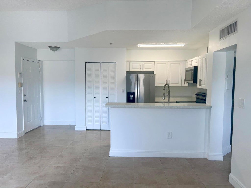Photo of 771 N PINE ISLAND Road #308, Plantation, FL 33324 (MLS # B26085107)