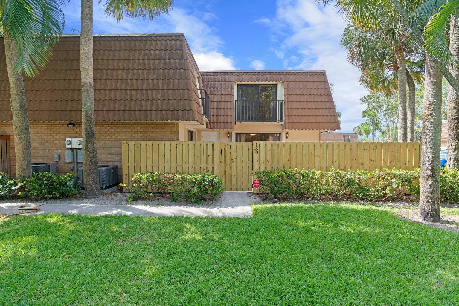 Stunning 2/2.5 townhome! Centrally located in the heart of West Palm Beach, this home is about 10 minutes away from the Palm Beach Outlets, a few minutes from I95, and near to Downtown West Palm Beach and Palm Beach International Airport. This home offers a large fenced patio area that's perfect for hosting get-togethers with friends and family. The home features beautiful wood plank tile throughout the main level and the kitchen. Upstairs has vinyl flooring. Remodeled kitchen and all 3 bathrooms. The home also has accordion hurricane shutters.