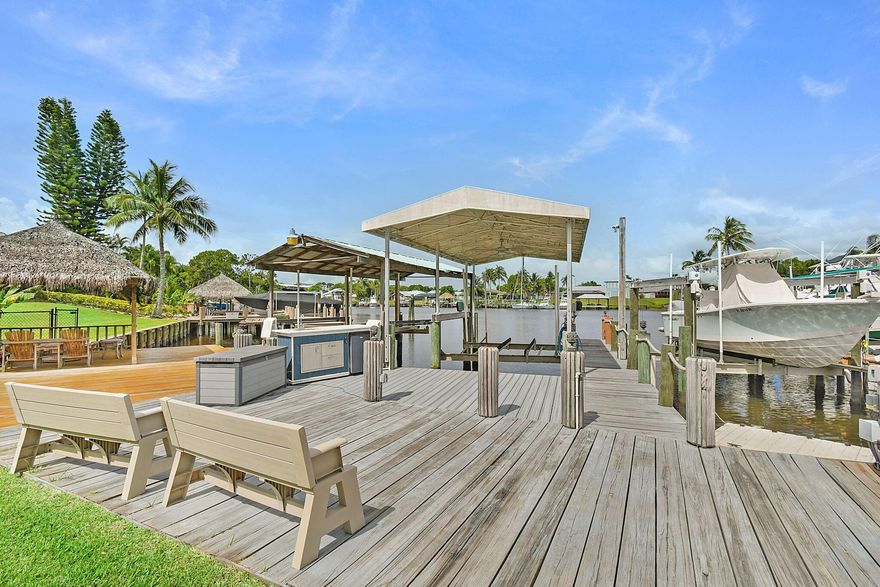 Waterfront Paradise with Ocean Access -- Ideal for Boaters & RV Enthusiasts!
Welcome to your South Florida coastal retreat! Perfectly situated on a premium corner lot with direct ocean access and no fixed bridges, this stunning CBS home offers 4 spacious bedrooms, 2 updated baths, and a 2-car garage. Meticulously designed for both comfort and entertainment, the property boasts a screen-enclosed pool and expansive patio, seamlessly blending indoor and outdoor living. Boating enthusiasts will appreciate the private dock with lift, full electric and water hook-ups, while RV owners will find the rebar-reinforced driveway with dedicated A-Class RV parking, complete with electric service, a rare and invaluable feature. The circular drive provides ample guest parking for effortless entertaini The backyard is a true tropical oasis, featuring a lovely waterfall feature on your pool, along with a custom tiki bar, two outdoor kitchenettes, fruiting mango trees, and a wired 220V shed perfect for hobbies or storage. Inside, you'll find solid construction, a designated safe room, and thoughtful upgrades throughout. With no HOA restrictions, enjoy the freedom to live your waterfront lifestyle without compromise.  This one-of-a-kind property combines privacy, convenience, and luxury just minutes to open water, all while being a storm hideaway for your boat.  An exceptional opportunity for discerning buyers seeking an entertainer's dream home with unparalleled boating and RV accommodations.  Waterfront living with direct ocean access and no fixed bridges in the heart of Port St. Lucie.  No HOA restrictions. Easy access to shopping, dining, and major roadways while enjoying peaceful waterfront privacy.
A rare opportunity to own a true boater's retreat where your home doubles as your marina.  INSPECTION REPORT STATES THAT THERE IS 17 YEARS OF LIFE REMAINING ON THE ROOF! Schedule your private showing today and start living the lifestyle you and your toys can get accustomed to!
