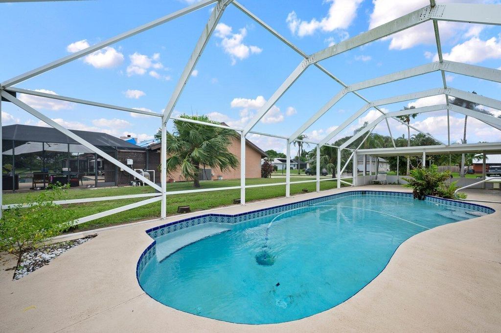 Photo of 2442 SE Gowin Drive, Port Saint Lucie, FL 34952 (MLS # R11005814)