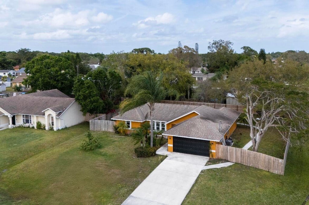 Photo of 353 NW FERRIS Drive, Port Saint Lucie, FL 34983 (MLS # B26059460)