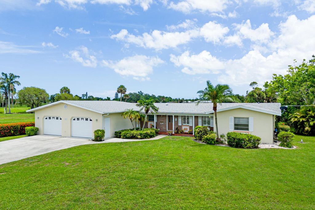 Photo of 3037 SE Treasure Island Road, Port Saint Lucie, FL 34952 (MLS # R10998122)