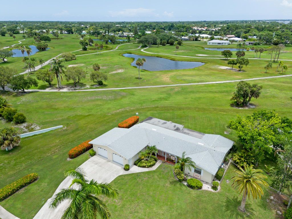 Photo of 3037 SE Treasure Island Road, Port Saint Lucie, FL 34952 (MLS # R10998122)