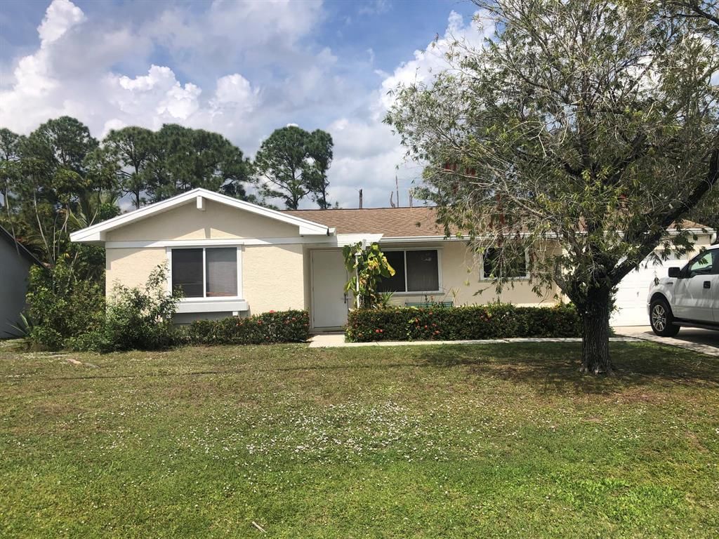 Photo of 2225 SE Blossom Road Rd, Port St Lucie, FL 34952 (MLS # R10783625)