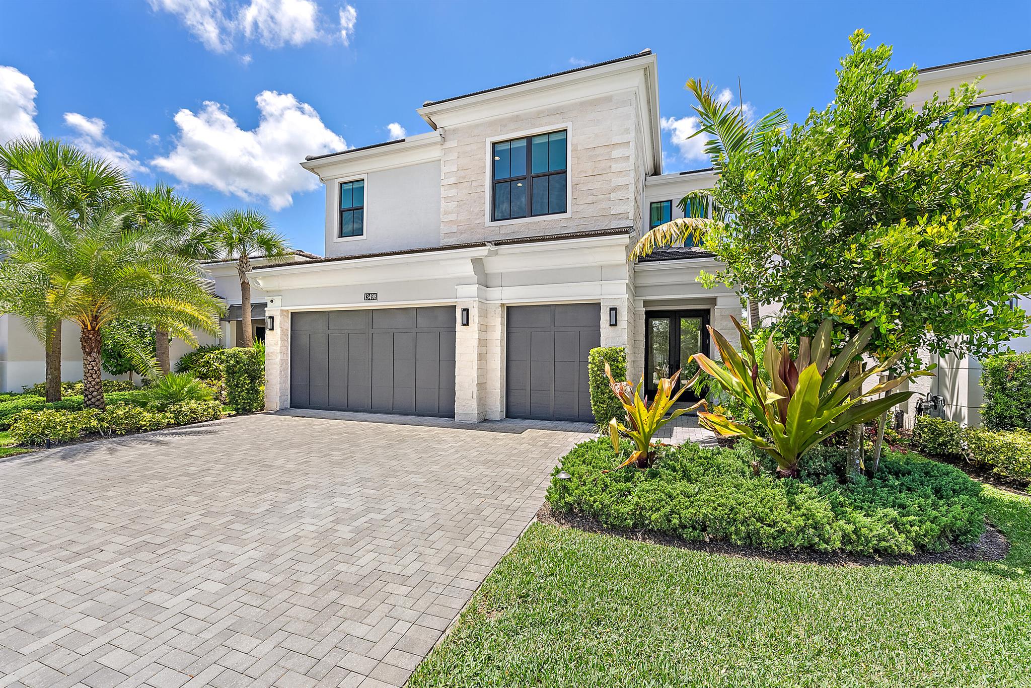 Welcome to 13498 Artisan Circle! This exquisite Hudson Model is located in the premier gated community of Artistry in Palm Beach Gardens, Florida. Offering the perfect blend of modern luxury, timeless elegance and thoughtful design. This home features owner-inspired enhancements that surpass even the builder's highest upgrade packages.This spacious home offers 5 bedrooms, 4 full bathrooms a 3-car garage and 3,577 sq ft of living space and built in 2022. A true entertainer's dream! From the moment you enter, you'll be greeted by soaring ceilings, abundant natural light, and open, flowing spaces that are ideal for both entertaining and everyday living. The chef's kitchen is a true showstopper! Showcasing GE Monogram 48'' gas range, 48'' smart built-in Side-By-Side Refrigerator