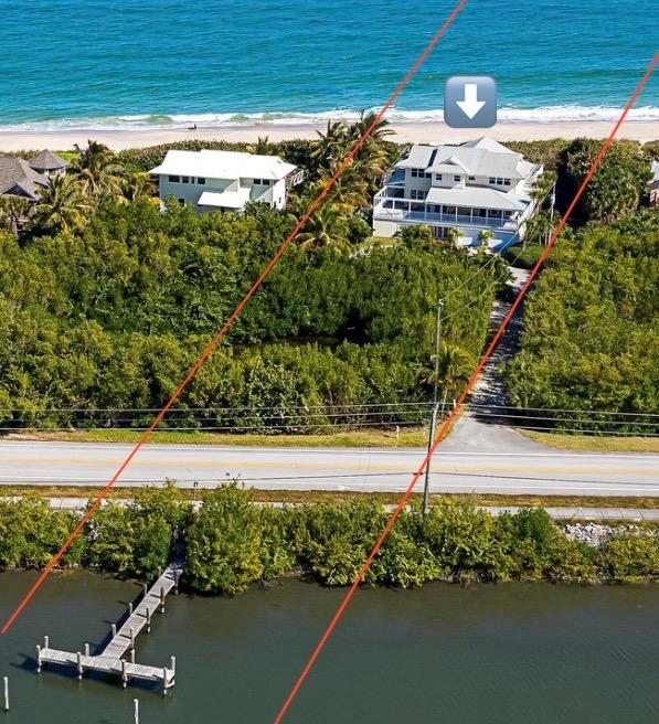 Charming, very private (Key West Style) 3-story, multi-generational beach home nestled between the Atlantic Ocean and the Indian River Lagoon (which flows into the Intracoastal). Relax on your 100-foot secluded beach and private river frontage (across A1A) with its own dock. Enjoy 1,800 sf of wraparound porches on all levels with 360 degree views of sunrises, sunsets, and wildlife. Home has 3 bedrooms, 4.5 baths, impact windows/doors, elevator, gas fireplace, bamboo flooring, 3 garages (one for boat), circular driveway. It is just 10 minutes to Vero Beach's restaurants, grocery, arts, golfing & more. Ambersand Beach is a unique Northern part of Vero Beach that's easily reachable from Orlando, Cocoa Beach, PB & Miami. No HOA.