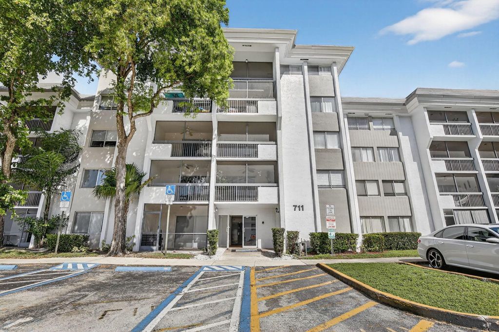 Photo of 711 N Pine Island Rd #319, Plantation, FL 33324 (MLS # F10532011)