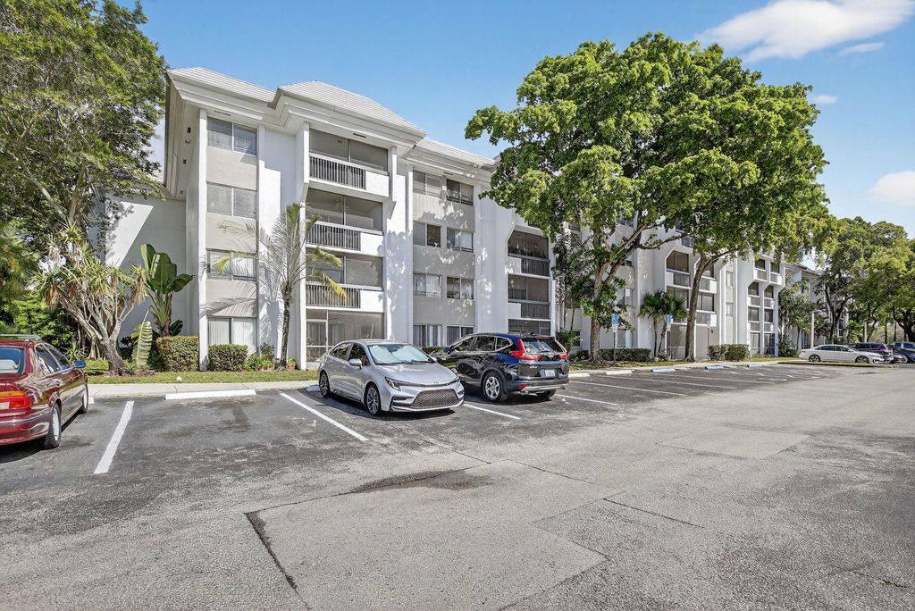 Photo of 711 N Pine Island Rd #319, Plantation, FL 33324 (MLS # F10532011)