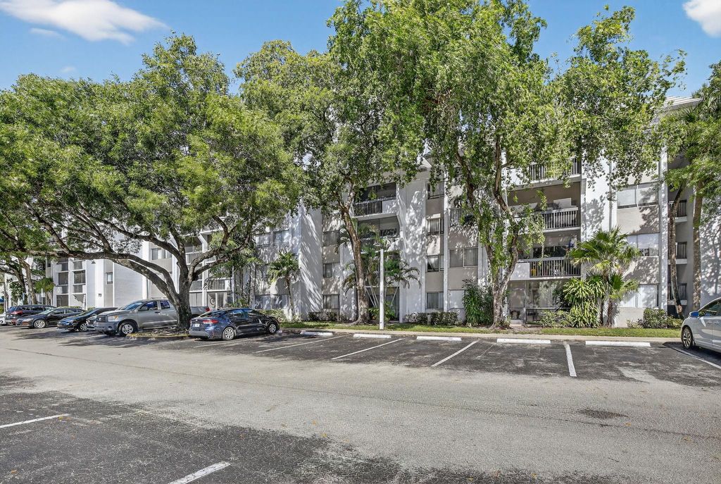 Photo of 711 N Pine Island Rd #319, Plantation, FL 33324 (MLS # F10532011)