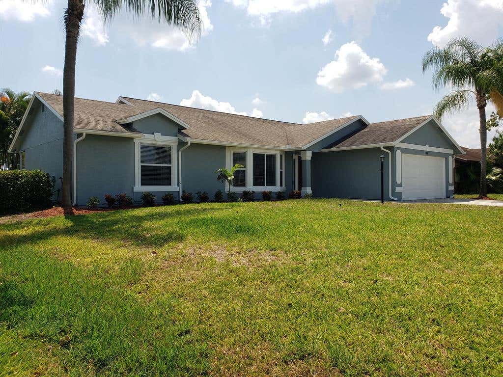 Photo of 1189 SW Cynthia Street, Port Saint Lucie, FL 34983 (MLS # R10801762)